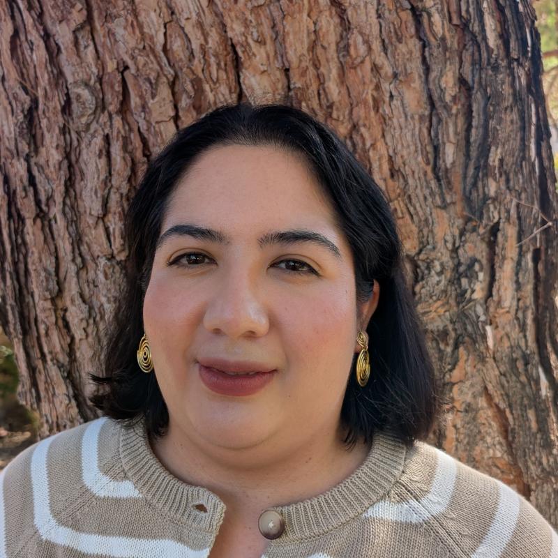 Image shows Vanessa with a background of tree.
